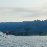 Women surfing in Matapalo, Costa Rica.
