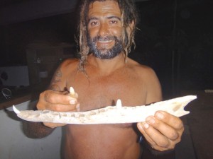 Esteban with a crocodile tooth.