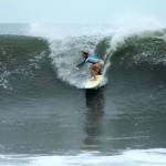 Aloe Driscoll surfing in El Salvador.