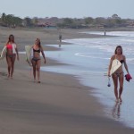 Women surfing in Miramar, Nicaragua